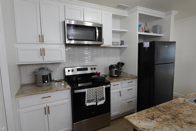 3020 W 15th St, Odessa, TX 79763 - kitchen with stainless steel appliances, open shelves, white cabinetry, decorative backsplash, and crown molding