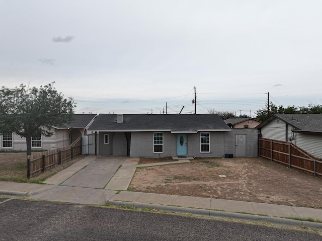3020 W 15th St, Odessa, TX 79763 - ranch-style home featuring driveway, roof with shingles, and brick siding