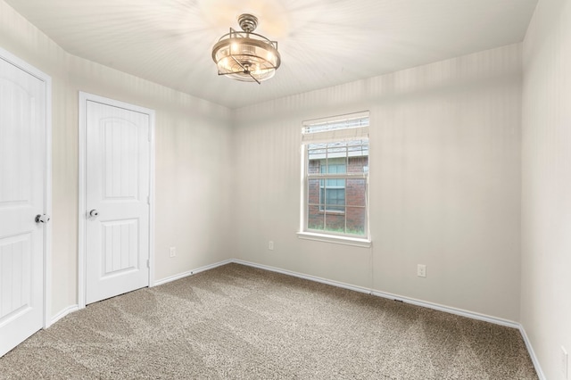 304 E 94th St, Odessa, TX 79765 - carpeted spare room featuring baseboards