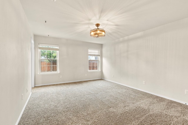 304 E 94th St, Odessa, TX 79765 - empty room featuring carpet floors and plenty of natural light