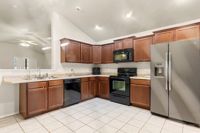 304 E 94th St, Odessa, TX 79765 - kitchen with black appliances, vaulted ceiling, light countertops, light tile patterned flooring, and ceiling fan