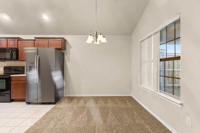 304 E 94th St, Odessa, TX 79765 - kitchen featuring black appliances, a chandelier, vaulted ceiling, brown cabinets, and decorative light fixtures