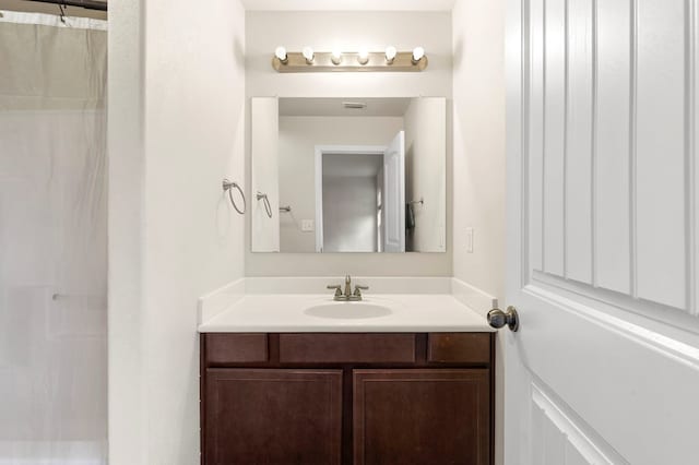304 E 94th St, Odessa, TX 79765 - bathroom featuring vanity and a shower