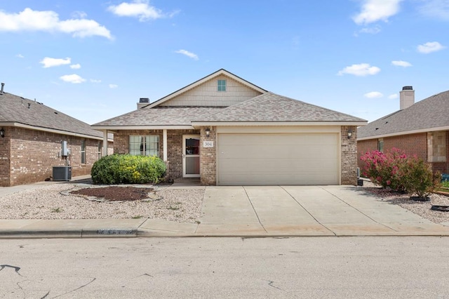 304 E 94th St, Odessa, TX 79765 - view of front of house with driveway, an attached garage, brick siding, and roof with shingles