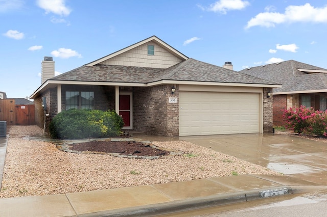 304 E 94th St, Odessa, TX 79765 - view of front of property with brick siding, an attached garage, concrete driveway, and roof with shingles