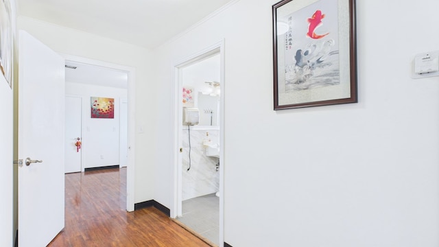 912 W 7th St, Pecos, TX 79772 - hallway with ornamental molding and wood finished floors