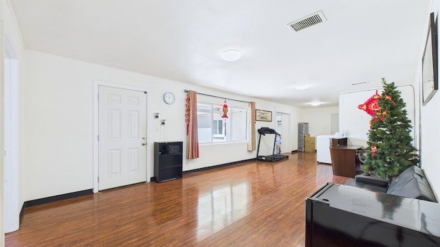 912 W 7th St, Pecos, TX 79772 - living area featuring wood finished floors and baseboards