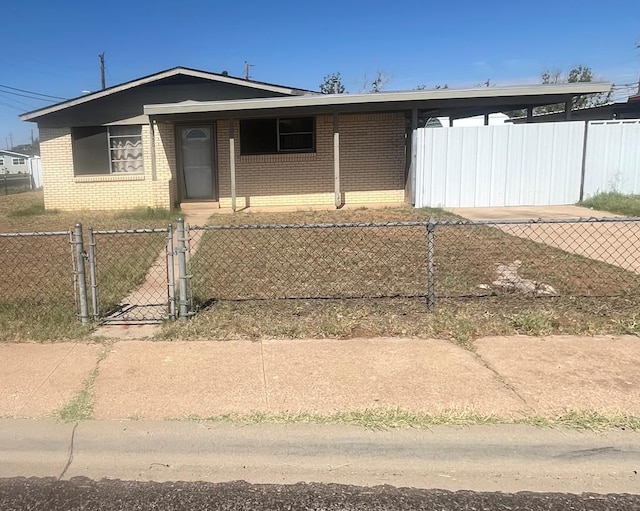 3501 Merrill Ave, Odessa, TX 79764 - view of front of house featuring a fenced front yard, brick siding, a gate, and a porch