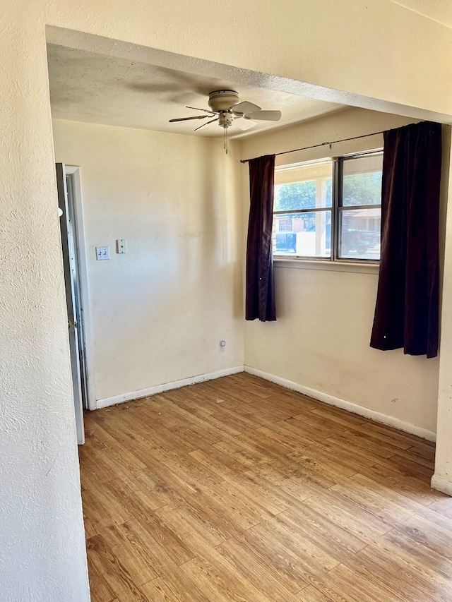 3501 Merrill Ave, Odessa, TX 79764 - empty room with light wood-style floors, a ceiling fan, and a textured ceiling