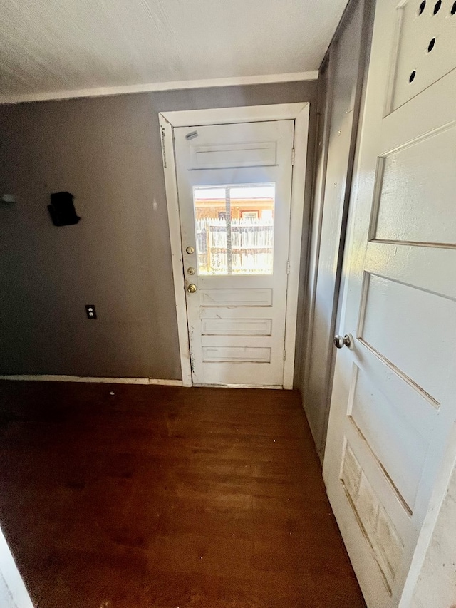 3501 Merrill Ave, Odessa, TX 79764 - doorway featuring wood finished floors and crown molding
