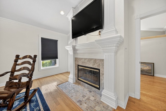 2720 Fair Oaks Cir, Odessa, TX 79762 - living area with a tile fireplace, wood finished floors, and ornamental molding