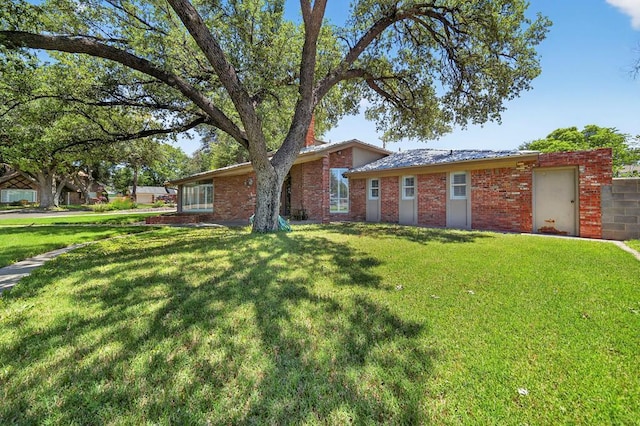 2720 Fair Oaks Cir, Odessa, TX 79762 - single story home featuring a front lawn and brick siding