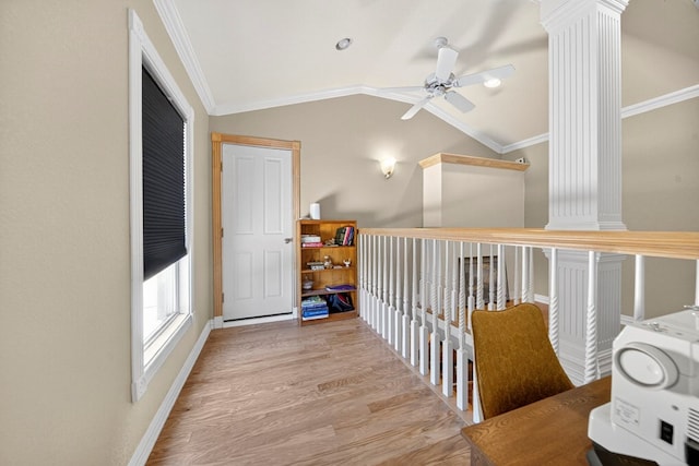 2720 Fair Oaks Cir, Odessa, TX 79762 - hallway featuring ornate columns, ornamental molding, vaulted ceiling, and wood finished floors