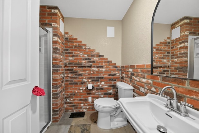 2720 Fair Oaks Cir, Odessa, TX 79762 - full bathroom with a stall shower and brick wall