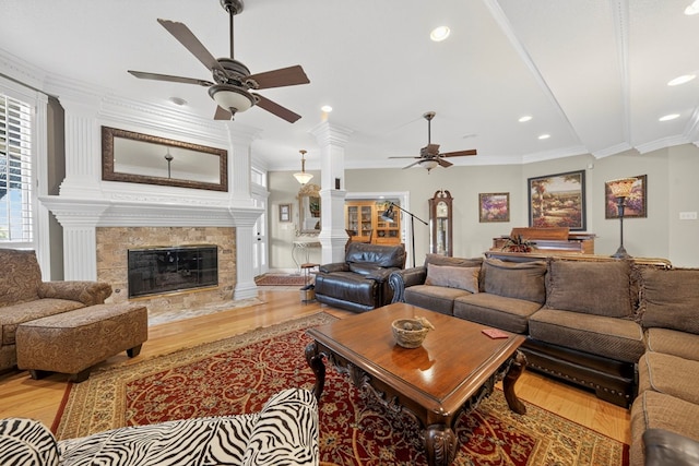 2720 Fair Oaks Cir, Odessa, TX 79762 - living room with ceiling fan, wood finished floors, crown molding, recessed lighting, and a premium fireplace