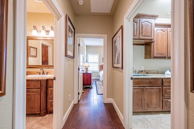 1006 W Cuthbert Ave, Midland, TX 79701 - hallway with a sink and wood finished floors