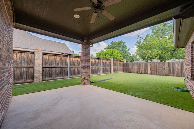 1006 W Cuthbert Ave, Midland, TX 79701 - fenced backyard with a ceiling fan and a patio area