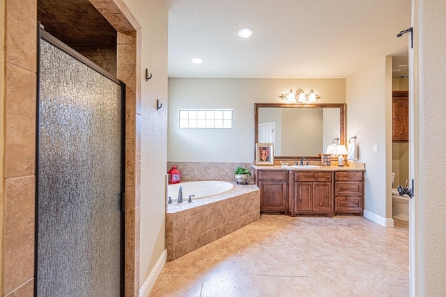 1006 W Cuthbert Ave, Midland, TX 79701 - full bathroom featuring a garden tub, vanity, a shower stall, tile patterned flooring, and recessed lighting