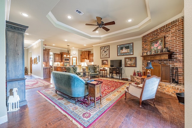 1006 W Cuthbert Ave, Midland, TX 79701 - living area featuring crown molding, ceiling fan, hardwood / wood-style flooring, a raised ceiling, and a fireplace