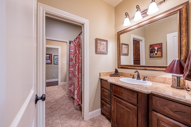 1006 W Cuthbert Ave, Midland, TX 79701 - full bath with vanity and tile patterned floors
