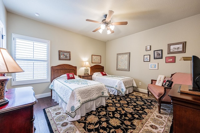 1006 W Cuthbert Ave, Midland, TX 79701 - bedroom featuring dark wood finished floors and a ceiling fan