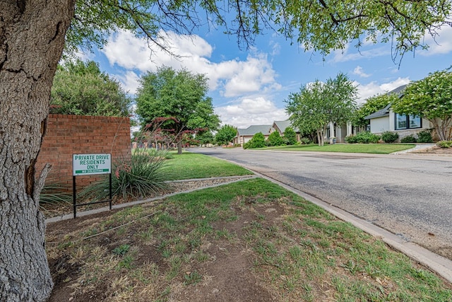 1006 W Cuthbert Ave, Midland, TX 79701 - view of asphalt street featuring a residential view and curbs