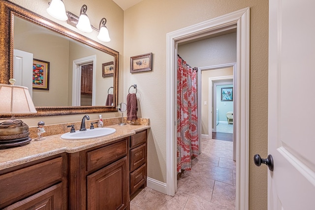 1006 W Cuthbert Ave, Midland, TX 79701 - full bathroom with vanity and baseboards