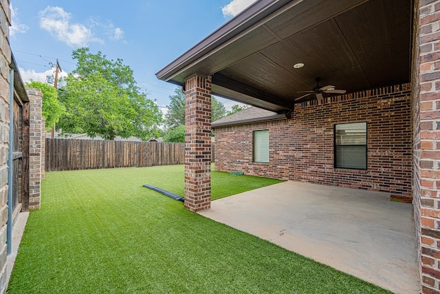 1006 W Cuthbert Ave, Midland, TX 79701 - fenced backyard featuring a ceiling fan and a patio