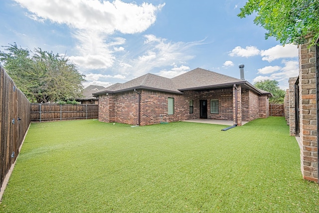 1006 W Cuthbert Ave, Midland, TX 79701 - rear view of house with brick siding, a fenced backyard, a shingled roof, and a patio area