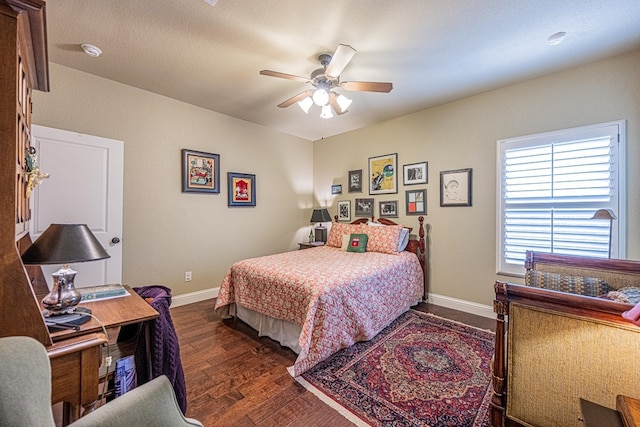 1006 W Cuthbert Ave, Midland, TX 79701 - bedroom with dark wood-style floors and a ceiling fan