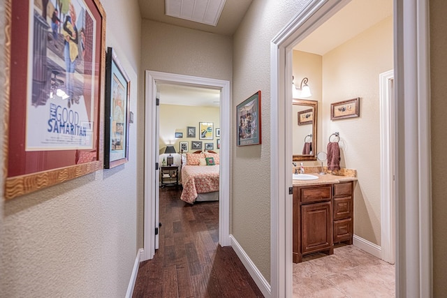 1006 W Cuthbert Ave, Midland, TX 79701 - corridor with a textured wall and light wood-style flooring