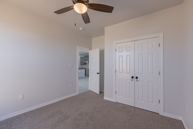 309 S Hancock Ave, Odessa, TX 79761 - unfurnished bedroom featuring carpet flooring, a closet, and a ceiling fan