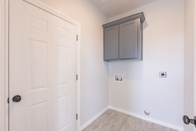 309 S Hancock Ave, Odessa, TX 79761 - laundry area featuring washer hookup, hookup for an electric dryer, and light marble finish floors