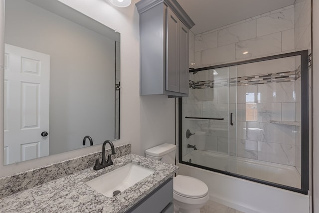 309 S Hancock Ave, Odessa, TX 79761 - bathroom with vanity and bath / shower combo with glass door