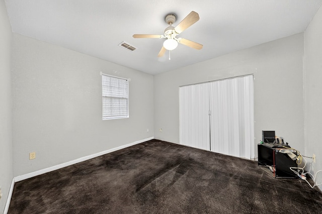 1321 Lindberg St, Odessa, TX 79763 - unfurnished bedroom featuring carpet floors, a desk, and a ceiling fan
