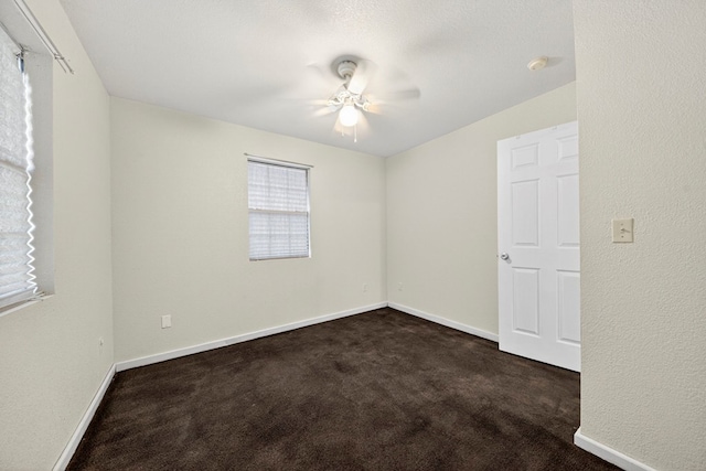 1321 Lindberg St, Odessa, TX 79763 - spare room with dark carpet and ceiling fan