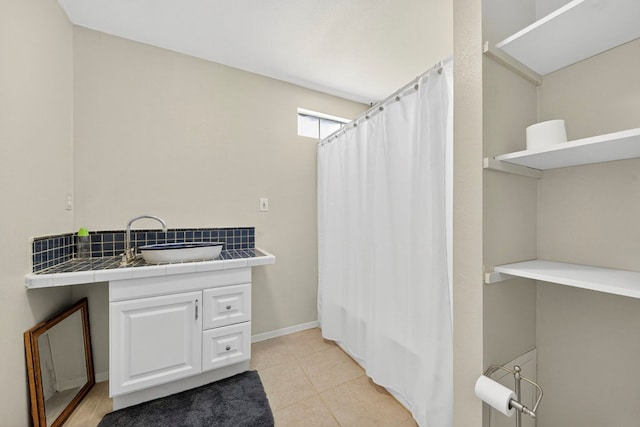 1321 Lindberg St, Odessa, TX 79763 - full bath with vanity, tile patterned floors, and a shower with shower curtain