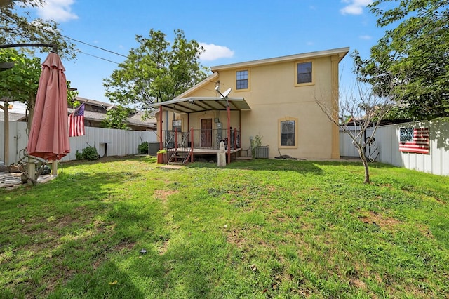 1321 Lindberg St, Odessa, TX 79763 - back of house with a fenced backyard, a deck, and stucco siding