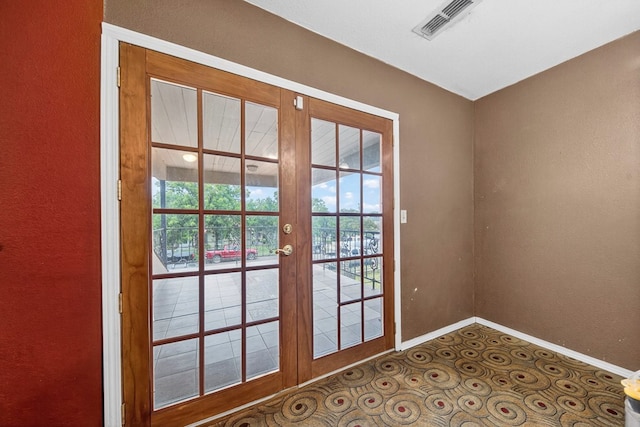1321 Lindberg St, Odessa, TX 79763 - doorway with plenty of natural light and a textured wall