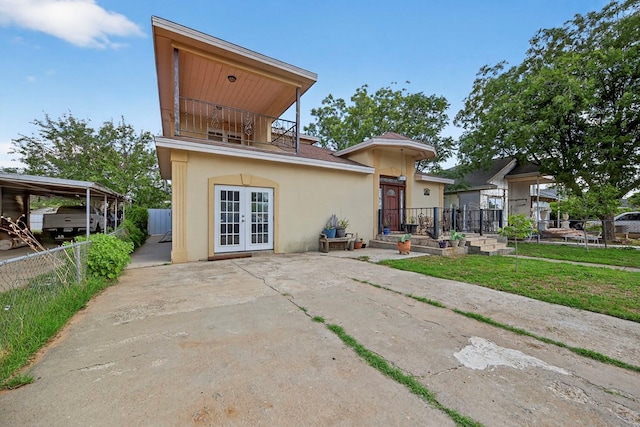 1321 Lindberg St, Odessa, TX 79763 - back of property featuring french doors and stucco siding
