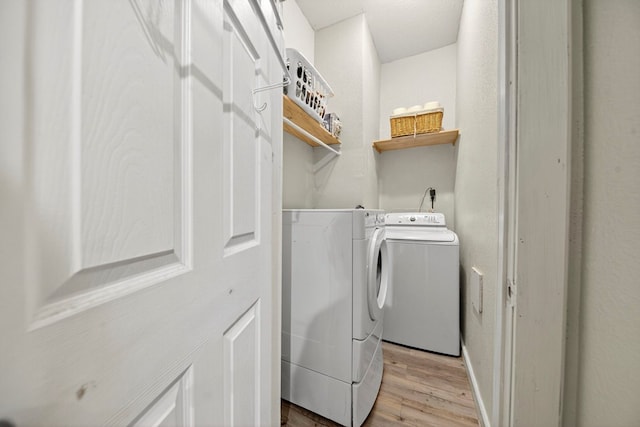1321 Lindberg St, Odessa, TX 79763 - washroom with light wood-style flooring and washer and clothes dryer