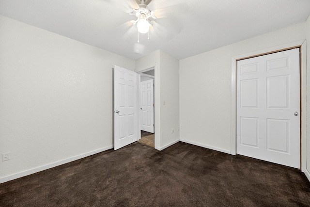 1321 Lindberg St, Odessa, TX 79763 - unfurnished bedroom featuring dark colored carpet and a ceiling fan