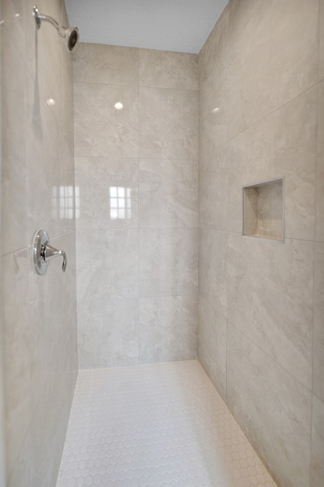 full bathroom with tiled shower