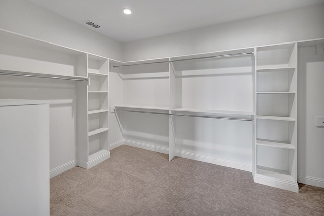 walk in closet with carpet floors and visible vents