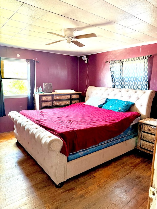 189 County Road 401-l, Seminole, TX 79360 - bedroom with hardwood / wood-style flooring and a ceiling fan