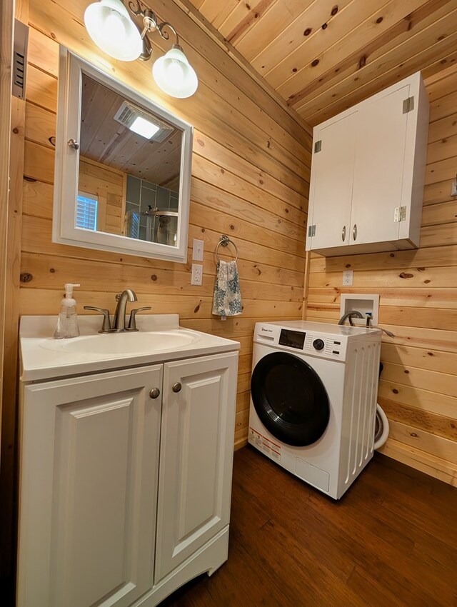 307 Cochise Canyon Trl, Fort Davis, TX 79734 - laundry area featuring washer / clothes dryer, wooden walls, cabinet space, wood ceiling, and dark wood-style floors