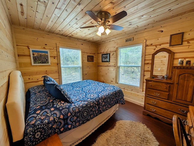 307 Cochise Canyon Trl, Fort Davis, TX 79734 - bedroom with wood ceiling, dark wood finished floors, wood walls, and ceiling fan