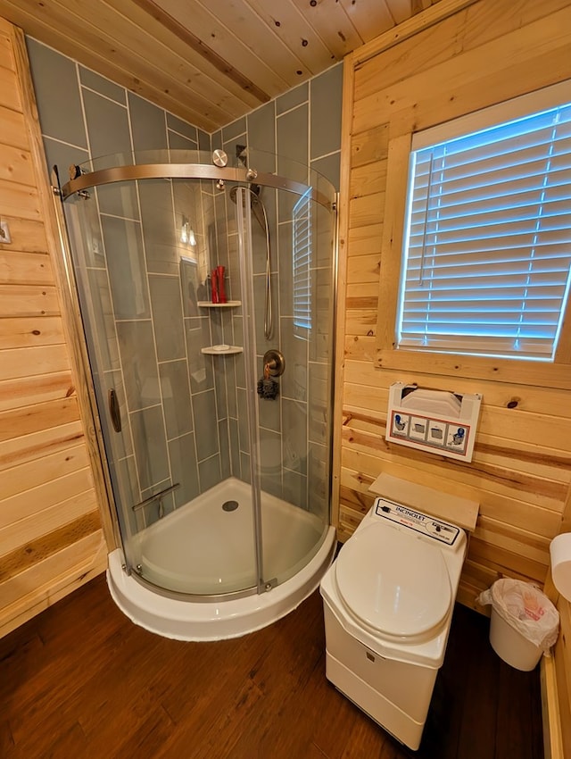 307 Cochise Canyon Trl, Fort Davis, TX 79734 - bathroom featuring wooden ceiling, a shower stall, wooden walls, and wood finished floors