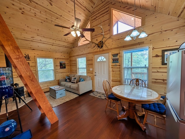 307 Cochise Canyon Trl, Fort Davis, TX 79734 - dining space featuring wooden walls, high vaulted ceiling, wooden ceiling, dark wood-type flooring, and ceiling fan