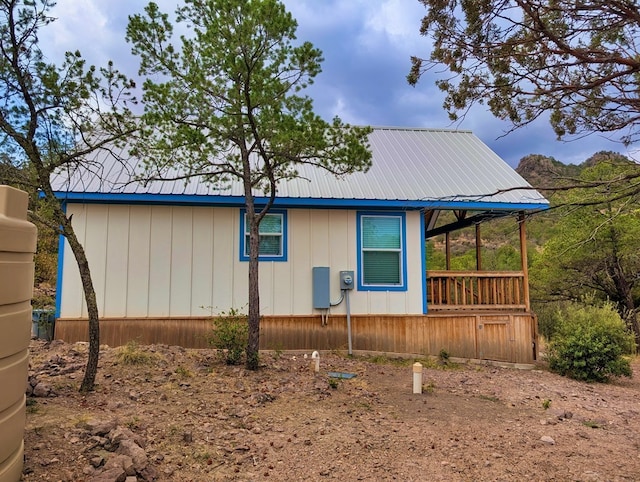 307 Cochise Canyon Trl, Fort Davis, TX 79734 - view of side of home featuring metal roof and a porch